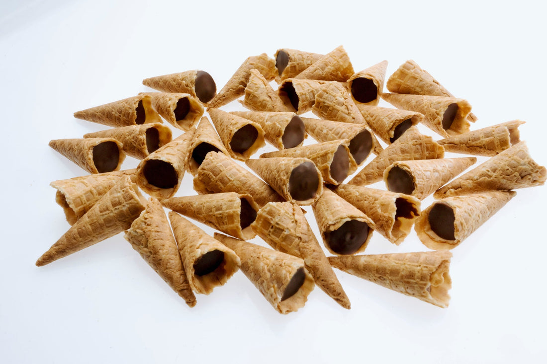 Tippies waffle cone tips with milk, dark and white chocolate flavoured fillings, tipped out of their pouches