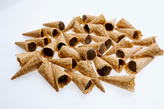 Tippies waffle cone tips with milk, dark and white chocolate flavoured fillings, tipped out of their pouches
