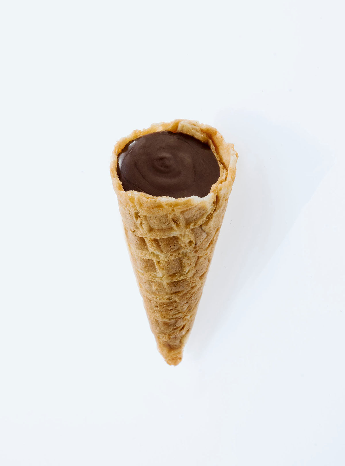Close-up of Dark Choc Tippies showing the crunchy waffle cone and dark chocolate flavoured filling inside
