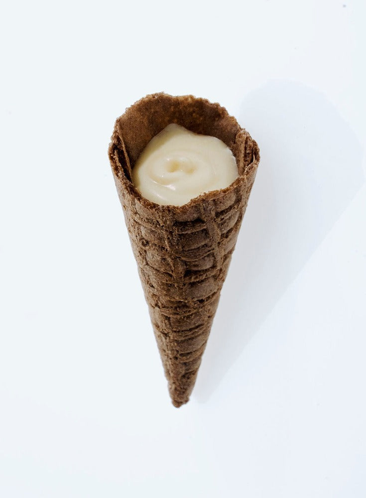 Close-up of White Choc Tippies showing the crunchy waffle cone and white chocolate flavoured filling inside
